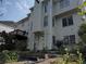 Backyard of home featuring landscaped garden area, covered deck, and multi-level structure at 2905 Olde Town Park Dr, Norcross, GA 30071