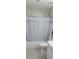 Clean bathroom with a tub and shower combination and white cabinetry at 2905 Olde Town Park Dr, Norcross, GA 30071