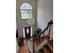 Entryway and staircase beneath a hanging chandelier at 2905 Olde Town Park Dr, Norcross, GA 30071
