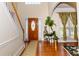 Inviting foyer with a chandelier, wood floors, and a staircase at 2905 Olde Town Park Dr, Norcross, GA 30071