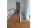 Spacious hallway features hardwood floors, white trim, and a staircase leading to additional living spaces at 2905 Olde Town Park Dr, Norcross, GA 30071