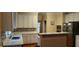 Renovated kitchen with white cabinetry, modern countertops, and stainless steel appliances at 2905 Olde Town Park Dr, Norcross, GA 30071
