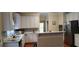 Updated kitchen with white cabinets, modern countertops, stainless steel appliances at 2905 Olde Town Park Dr, Norcross, GA 30071