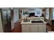 Open kitchen with stainless steel appliances, a cooking island, and a view of the living area at 2905 Olde Town Park Dr, Norcross, GA 30071