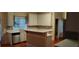 Bright kitchen with white cabinetry, stainless steel dishwasher, and ample counter space at 2905 Olde Town Park Dr, Norcross, GA 30071