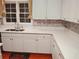 Bright kitchen featuring white cabinets, stone countertops, mosaic backsplash and a stainless steel sink at 2905 Olde Town Park Dr, Norcross, GA 30071