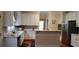 Spacious kitchen featuring white cabinets, modern countertops, and stainless steel appliances at 2905 Olde Town Park Dr, Norcross, GA 30071