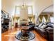 Bright living room with fireplace, hardwood floors, high ceilings, and large windows at 2905 Olde Town Park Dr, Norcross, GA 30071