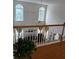 Bright living room showcasing high ceilings, large windows, and a cozy fireplace enhancing a welcoming and airy ambiance at 2905 Olde Town Park Dr, Norcross, GA 30071