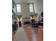 Bright living room with fireplace, hardwood floors, high ceilings, and large windows at 2905 Olde Town Park Dr, Norcross, GA 30071