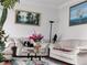 Cozy living room featuring white couches, decorative wall art, and a stylish glass table at 2905 Olde Town Park Dr, Norcross, GA 30071