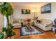 Comfortable living room with hardwood floors, large windows, and stylish furnishings at 2905 Olde Town Park Dr, Norcross, GA 30071