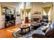 Hardwood floors and a fireplace highlight this living room with high ceilings and large windows at 2905 Olde Town Park Dr, Norcross, GA 30071