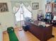 Well-lit home office space featuring hardwood floors and ample workspace at 2905 Olde Town Park Dr, Norcross, GA 30071