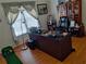 Well-lit home office space featuring hardwood floors and ample workspace at 2905 Olde Town Park Dr, Norcross, GA 30071