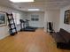 Bright workout room with gym equipment and hardwood floors at 2905 Olde Town Park Dr, Norcross, GA 30071