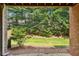View of the wooded backyard and greenery from the covered porch at 2969 Rivergreen Se Ln # 23, Atlanta, GA 30339