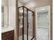 Bathroom featuring glass enclosed shower and a walk-in closet at 2969 Rivergreen Se Ln # 23, Atlanta, GA 30339