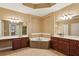 Ensuite bathroom featuring double vanity, a soaking tub and tile flooring at 2969 Rivergreen Se Ln # 23, Atlanta, GA 30339