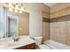 Well-maintained bathroom with ceramic tile, a vanity with a sink, toilet, and shower-tub combo at 2969 Rivergreen Se Ln # 23, Atlanta, GA 30339