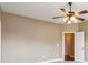 An empty bedroom with light beige walls with a door leading to the rest of the home at 2969 Rivergreen Se Ln # 23, Atlanta, GA 30339