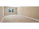 Large empty bedroom featuring carpeted floors, a window letting in natural light, and neutral paint at 2969 Rivergreen Se Ln # 23, Atlanta, GA 30339