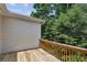 Exterior deck with wooden railings, offering a peaceful outdoor space and a view of the surrounding greenery at 2969 Rivergreen Se Ln # 23, Atlanta, GA 30339