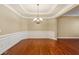 Spacious dining area with tray ceiling and hardwood floors, ready for your personal touch at 2969 Rivergreen Se Ln # 23, Atlanta, GA 30339