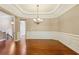 Open dining area with classic wainscoting and elegant chandelier for formal gatherings at 2969 Rivergreen Se Ln # 23, Atlanta, GA 30339