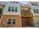 Exterior view of townhome features multiple balconies and large windows at 2969 Rivergreen Se Ln # 23, Atlanta, GA 30339