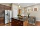 Modern kitchen with stainless steel appliances, center island, and wood cabinets at 2969 Rivergreen Se Ln # 23, Atlanta, GA 30339