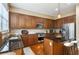 Renovated kitchen featuring wooden cabinets and a center island with seating at 2969 Rivergreen Se Ln # 23, Atlanta, GA 30339