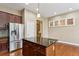 Stylish kitchen with a dark granite island, stainless steel appliances and wood flooring at 2969 Rivergreen Se Ln # 23, Atlanta, GA 30339