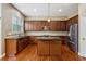 Spacious kitchen with dark wood cabinetry, stainless steel appliances, and island at 2969 Rivergreen Se Ln # 23, Atlanta, GA 30339