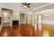 Open living room featuring a fireplace, hardwood floors, and an open-concept dining room at 2969 Rivergreen Se Ln # 23, Atlanta, GA 30339