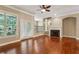 Bright living room featuring a fireplace, hardwood floors, and access to a balcony at 2969 Rivergreen Se Ln # 23, Atlanta, GA 30339