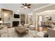 Living room featuring a fireplace, hardwood floors, and an open-concept dining room at 2969 Rivergreen Se Ln # 23, Atlanta, GA 30339