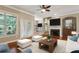 Comfortable living room with a fireplace, hardwood floors, and bright natural light at 2969 Rivergreen Se Ln # 23, Atlanta, GA 30339