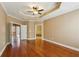 Large main bedroom with hardwood floors, tray ceiling, and access to an ensuite bath at 2969 Rivergreen Se Ln # 23, Atlanta, GA 30339