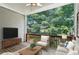 Inviting screened patio with seating offers a tranquil outdoor living space at 2969 Rivergreen Se Ln # 23, Atlanta, GA 30339