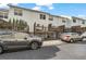 Exterior of townhomes displaying private decks, well-maintained yards, and rear parking access at 3014 Liberty Nw Way, Atlanta, GA 30318