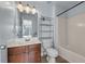 Bathroom featuring a wood vanity, a well-lit mirror, and a shower with a white shower curtain at 3014 Liberty Nw Way, Atlanta, GA 30318