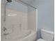Bathroom featuring a bathtub with shower and a toilet at 3014 Liberty Nw Way, Atlanta, GA 30318