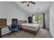 Bedroom with a neutral palette, carpeted floor, and a large window that lets in natural light at 3014 Liberty Nw Way, Atlanta, GA 30318