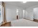 Bedroom featuring wood floors, natural light, and easy access to an ensuite bathroom at 3014 Liberty Nw Way, Atlanta, GA 30318