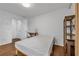 Bedroom featuring wood floors, a workspace area, and seamless access to a private bathroom at 3014 Liberty Nw Way, Atlanta, GA 30318