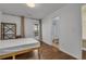 Modern bedroom with a platform bed, wood floors, and convenient access to an ensuite bathroom and outdoor patio at 3014 Liberty Nw Way, Atlanta, GA 30318