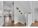 Bright entryway features hardwood floors, stairs to the second level, and door to the rear deck at 3014 Liberty Nw Way, Atlanta, GA 30318