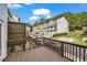 Townhouse community with exterior view of back deck featuring seating and privacy fence at 3014 Liberty Nw Way, Atlanta, GA 30318