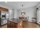 Kitchen boasts stainless appliances, wood cabinets, an island, and an eat-in dining area at 3014 Liberty Nw Way, Atlanta, GA 30318